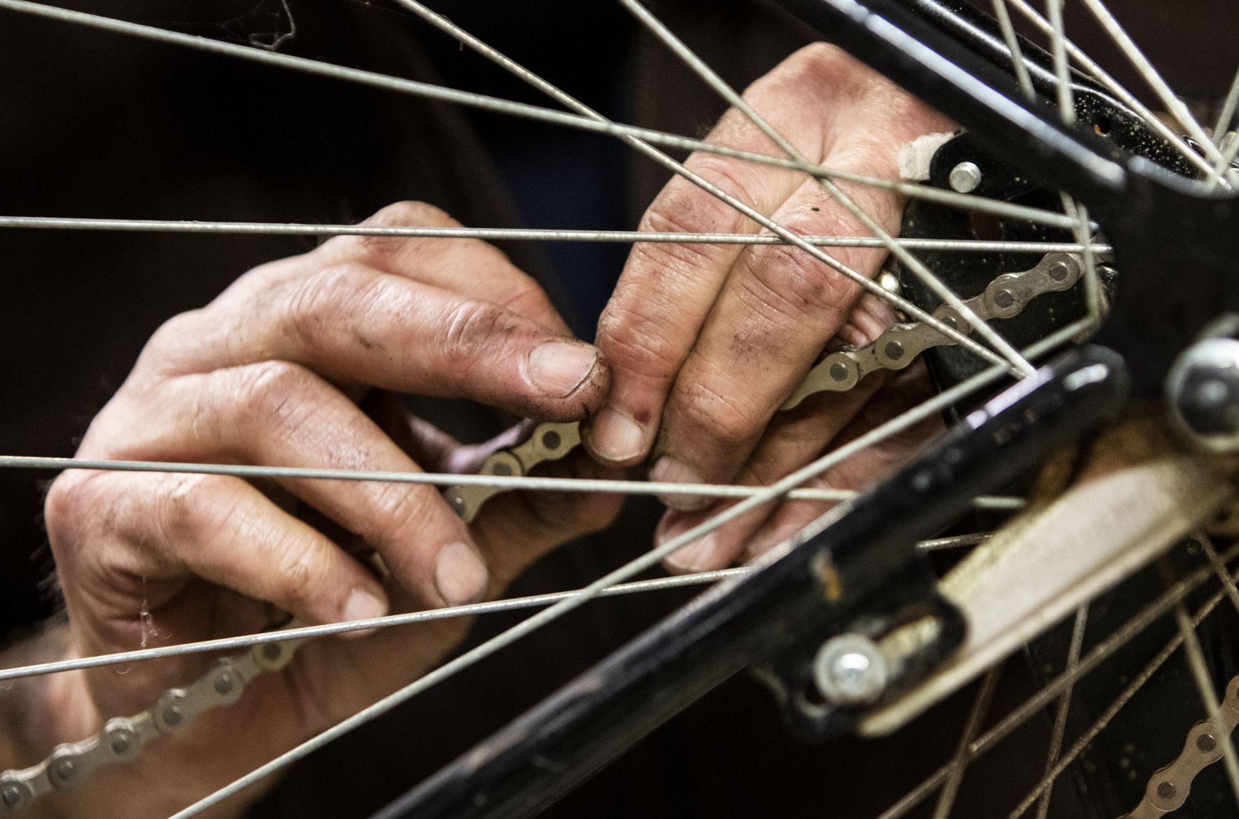 Volunteers and employees repair bikes at St. Louis BWorks in Soulard